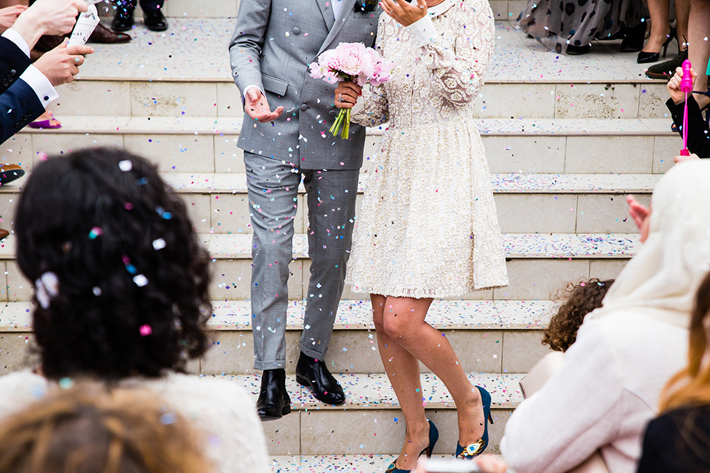Couple walking down steps after getting married